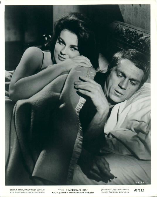 Melba (played by Ann-Margret) 
sneaks into bed with Eric (McQueen).