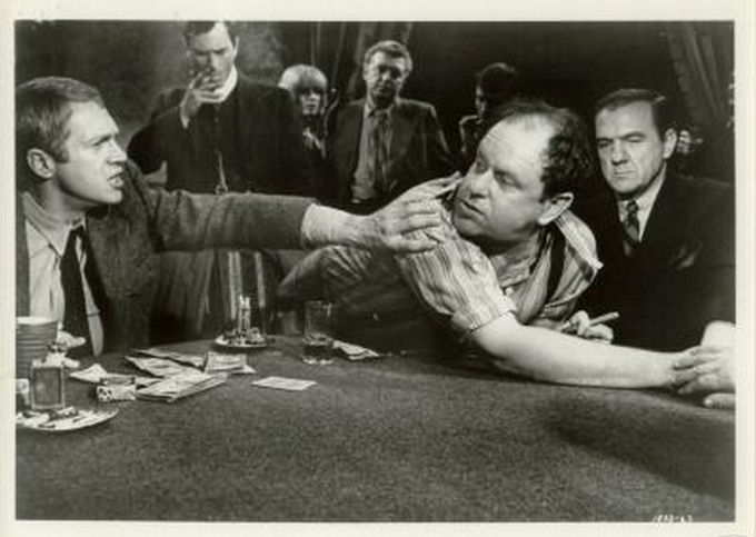 Tension mounts at the card table, as Eric (McQueen) 
tries to calm Pig (played by Jack Weston).