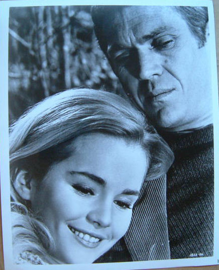 Christian (played by Tuesday Weld) 
and Eric (McQueen).  Hugging.