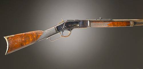 A Winchester late 1st Model 1873 Deluxe lever action rifle