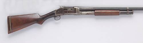 A Winchester Model 1897 slide action shotgun