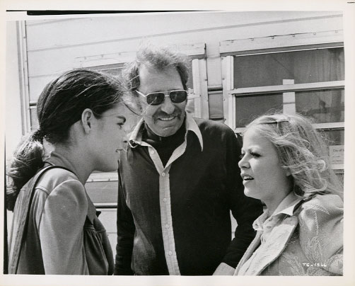 Ali MacGraw, Sam Peckinpah and Sally Struthers. Candid.