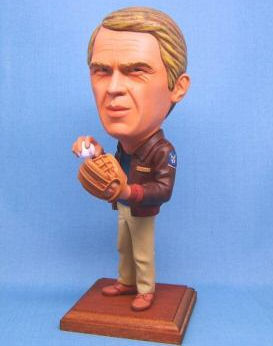 caricature figurine of virgil hilts with baseball glove and ball
