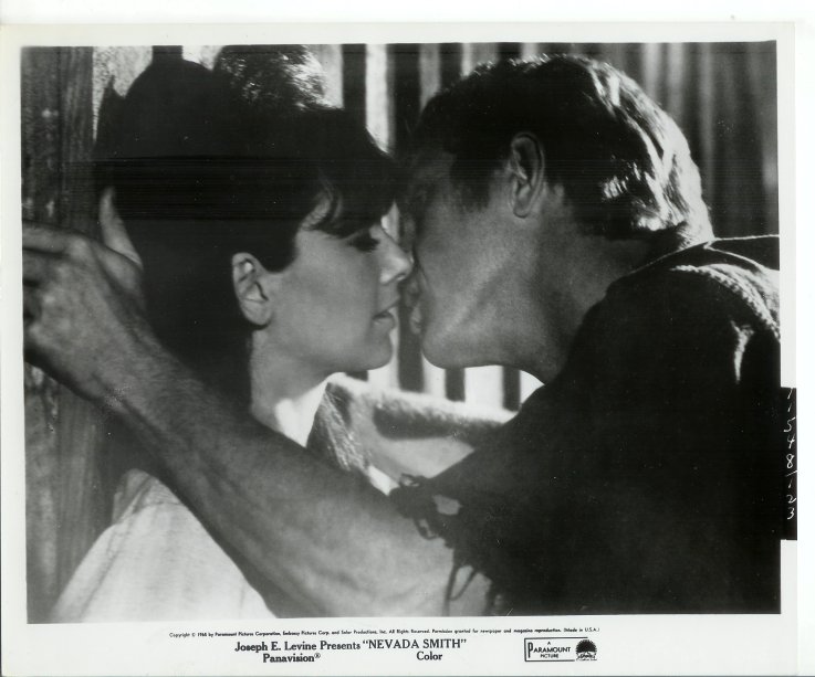 Max (McQueen) kisses Pilar (played by Suzanne Pleshette).