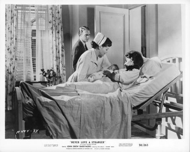 Steve McQueen as 'Martin' and Lita Milan as 'Julie'.