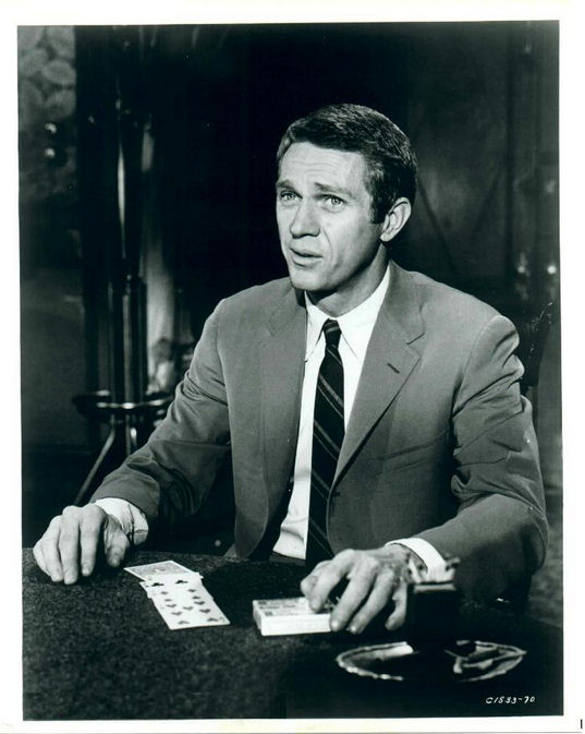 Eric (McQueen) deals the cards.